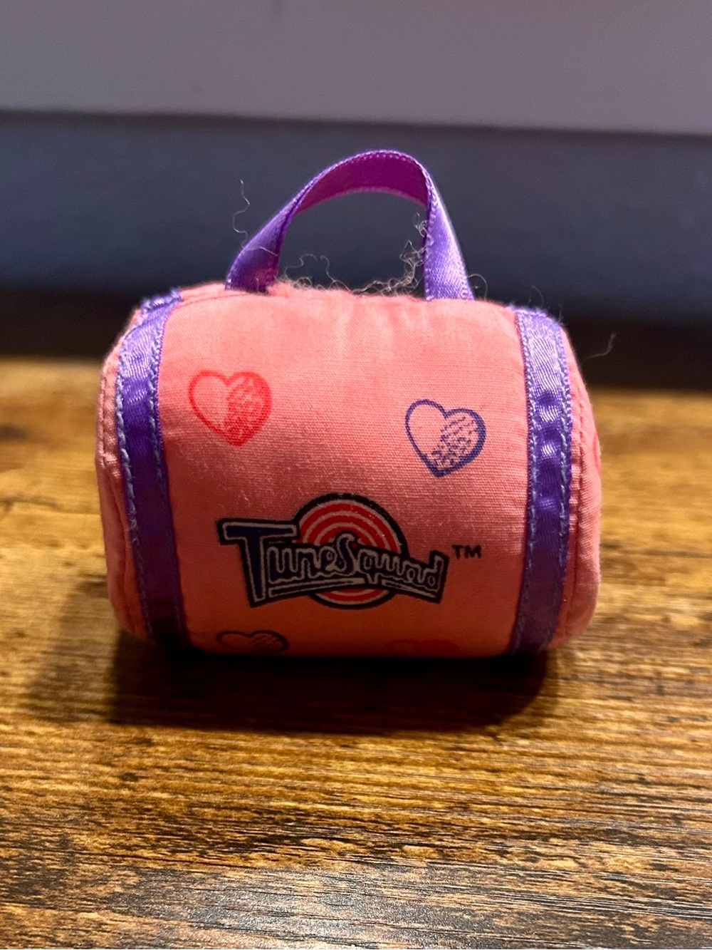 Warner Bros. pink plush Tune Squad duffel with purple trim